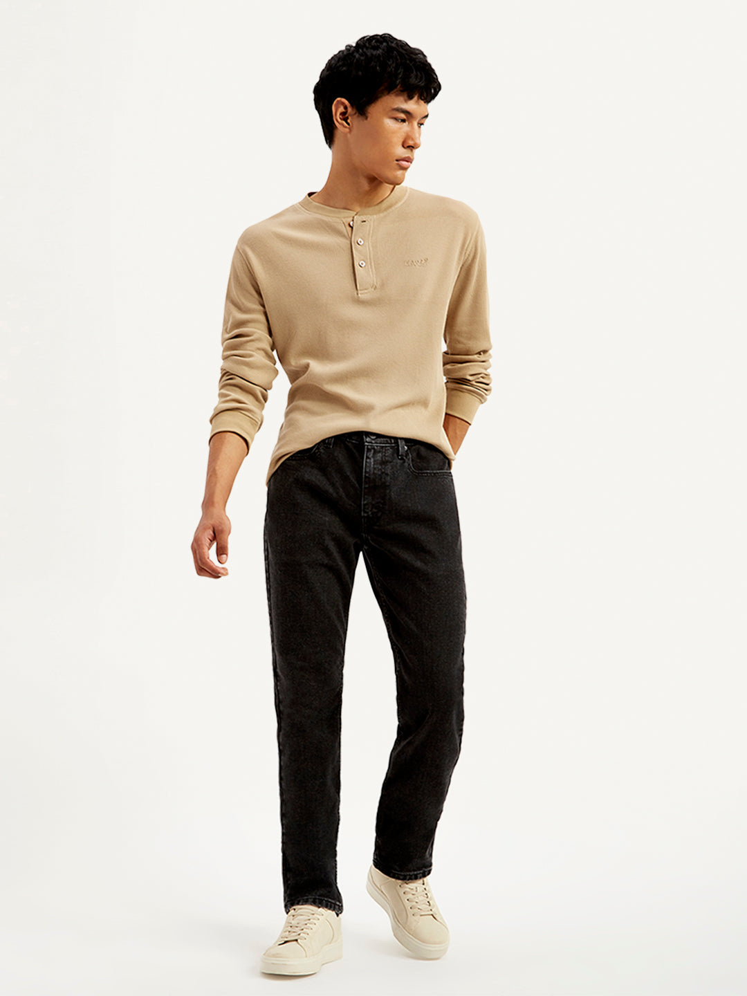 Levi's men's 511 black slim fit mid-rise jeans, front view showing classic five-pocket design and sleek denim fabric.