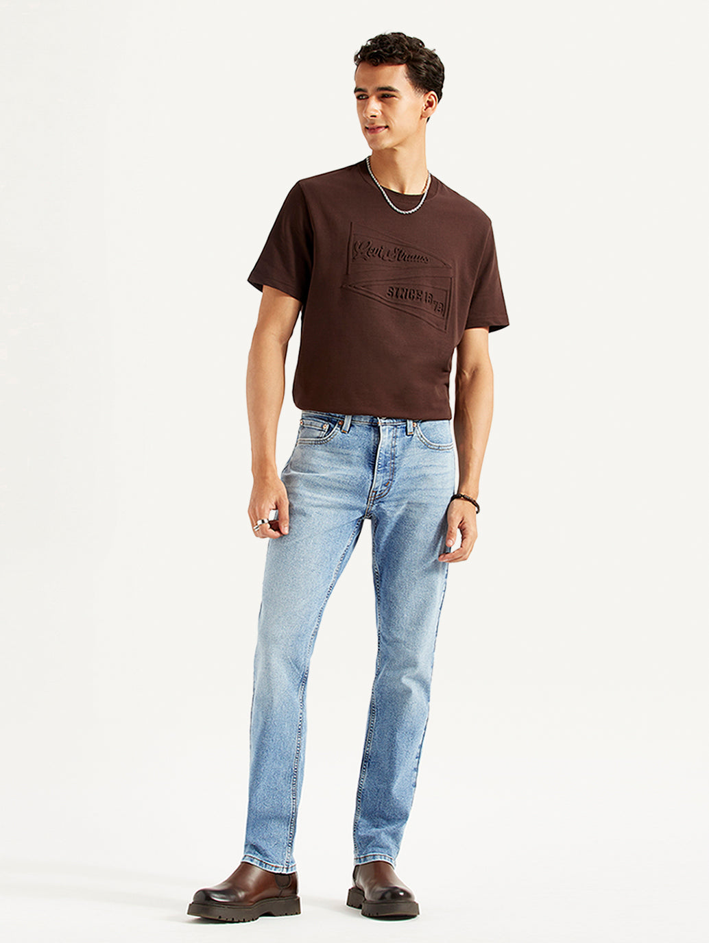 Men's Levi's 511 slim fit light blue mid-rise jeans, shown on a model, showcasing a modern and fitted denim style.