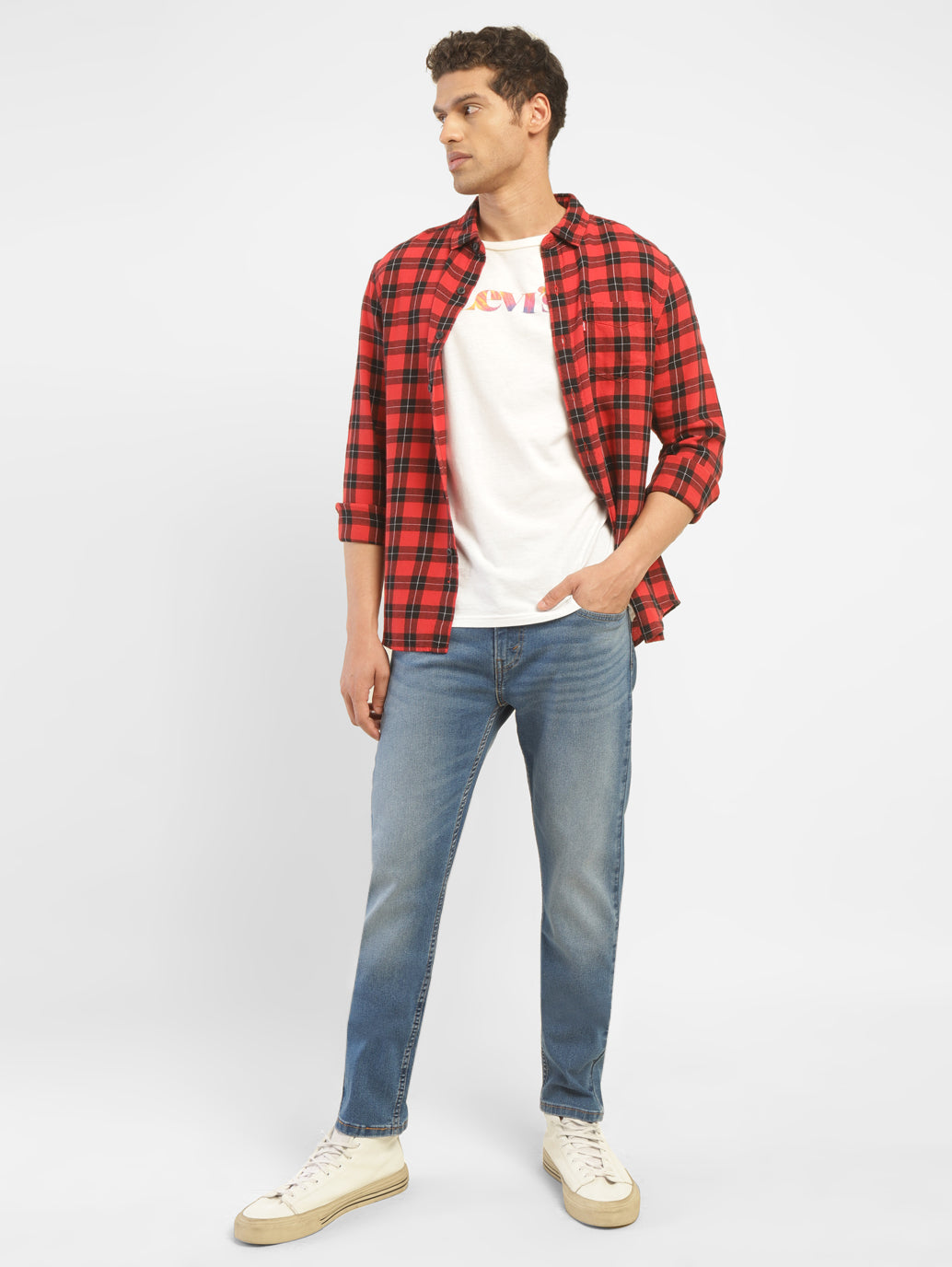 Levi's men's 512 blue slim tapered fit mid-rise jeans displayed on a model, showcasing the modern fit and denim fabric.