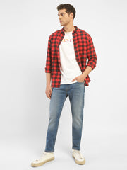 Levi's men's 512 blue slim tapered fit mid-rise jeans displayed on a model, showcasing the modern fit and denim fabric.