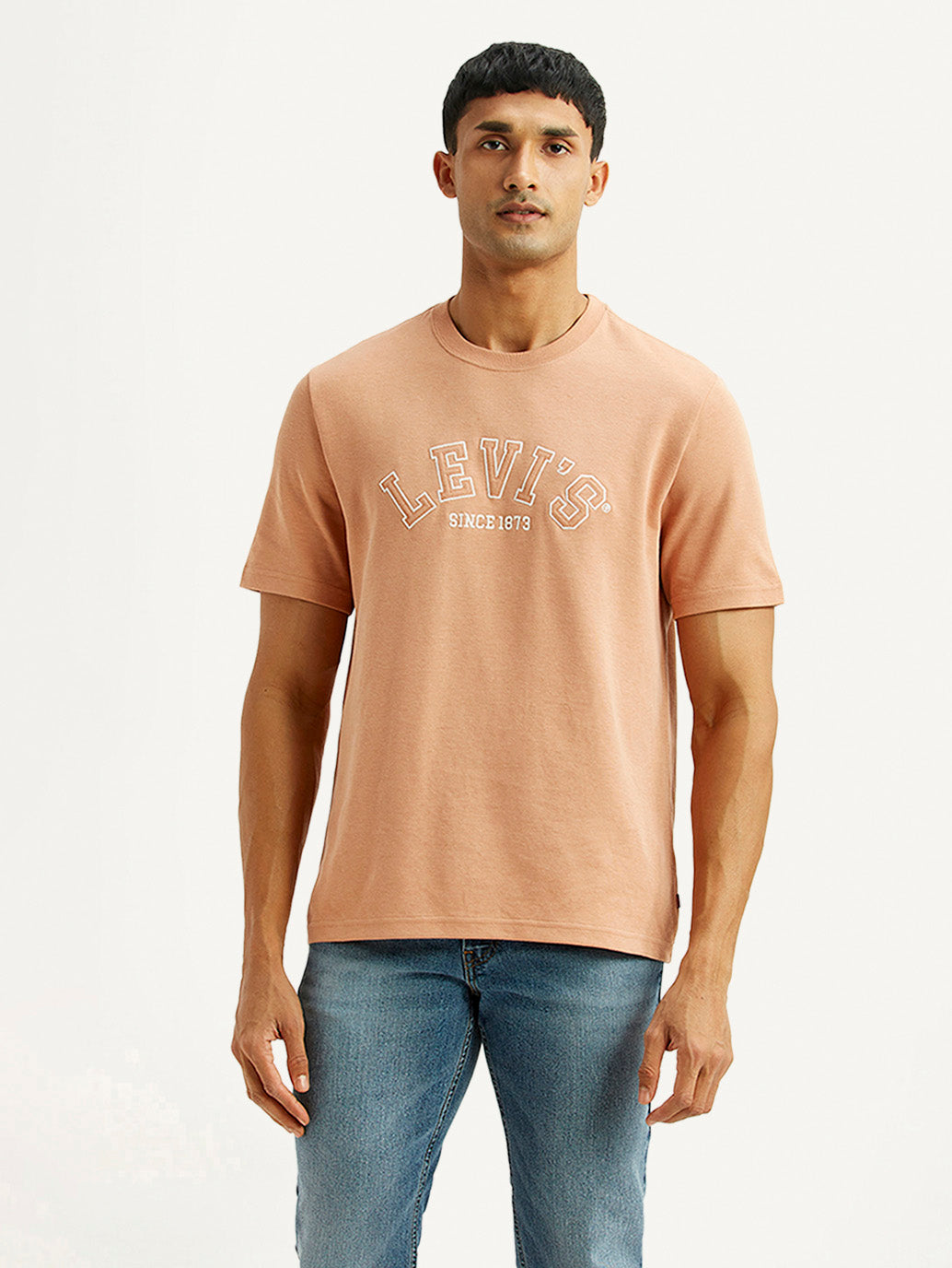 Levi's men's embroidered peach crew neck T-shirt with short sleeves, featuring colorful embroidery on the front.