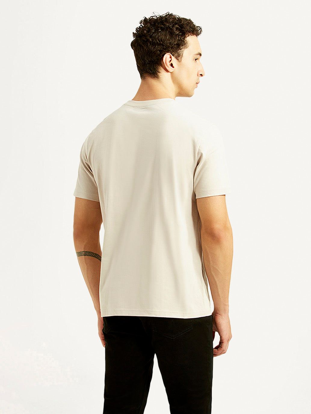 Levi's men's off-white crew neck T-shirt with graphic print, shown from the back, casual upper wear for men.