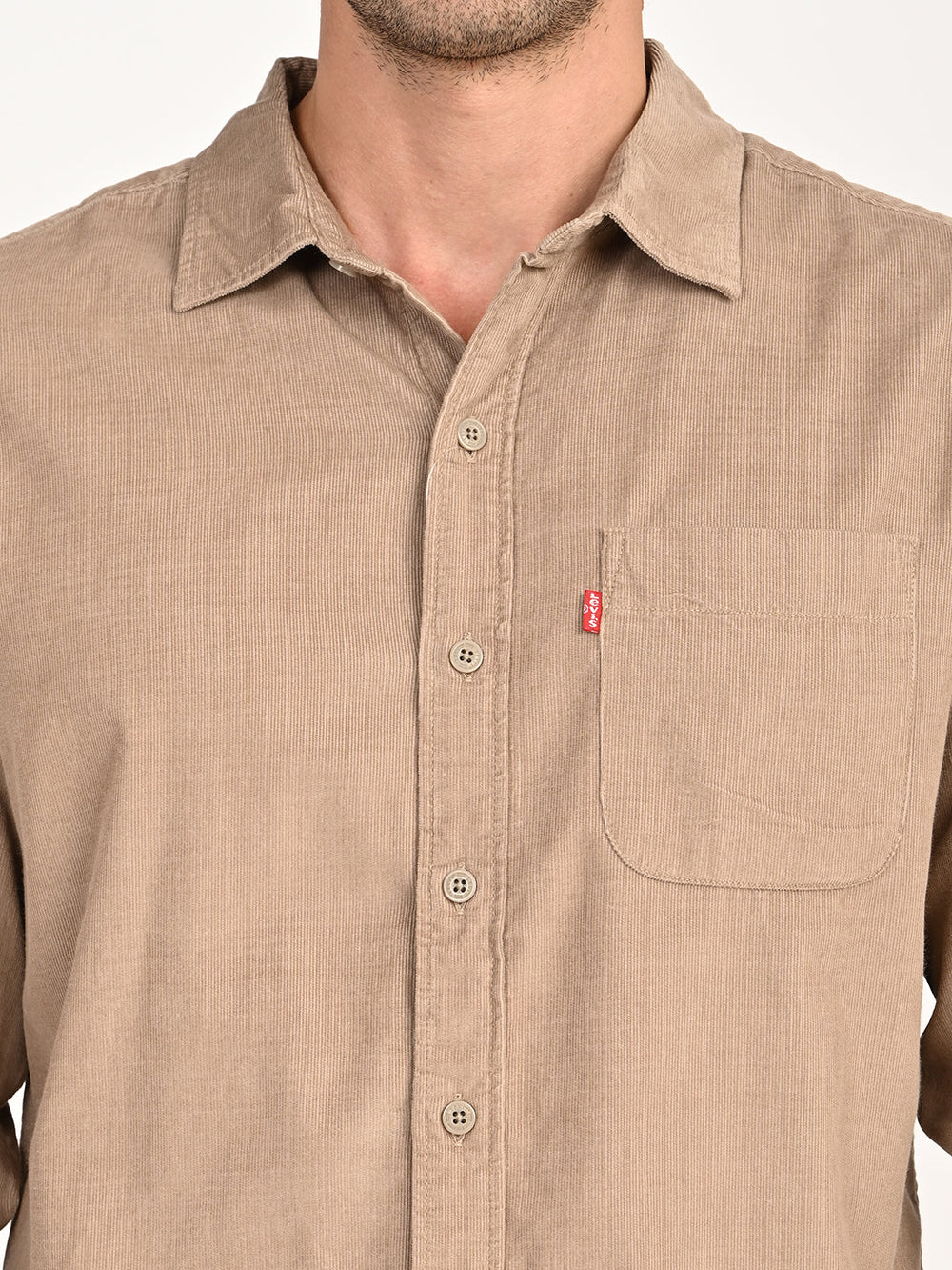 Levis men's beige slim fit corduroy casual shirt with collar and button details, displayed on a hanger.