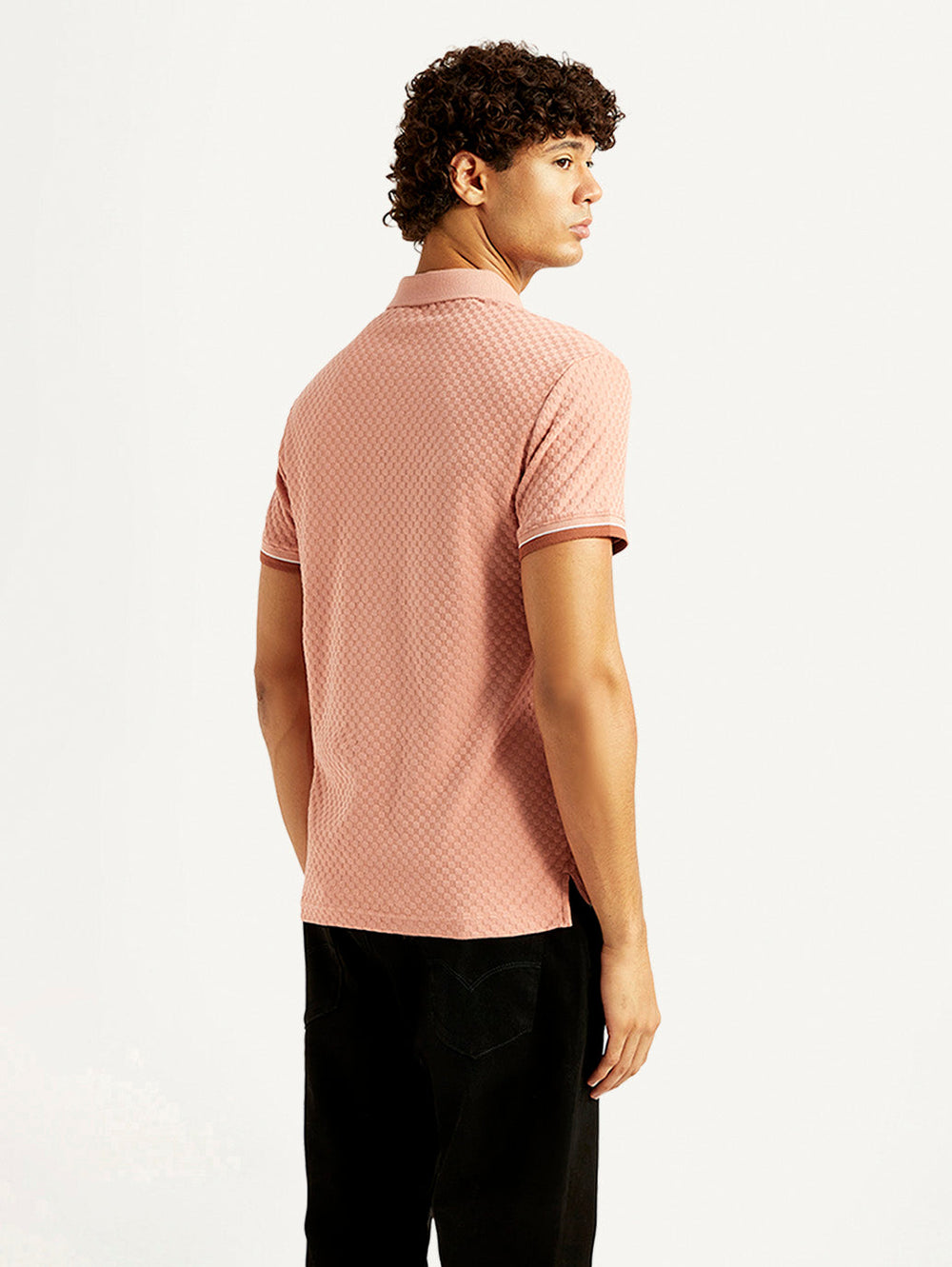Levi's men's red textured pink slim fit polo T-shirt shown from the back, short-sleeve design, casual upper wear.