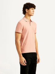 Levis men's redloop textured pink slim fit polo t-shirt, side view showing short sleeves and classic collar.