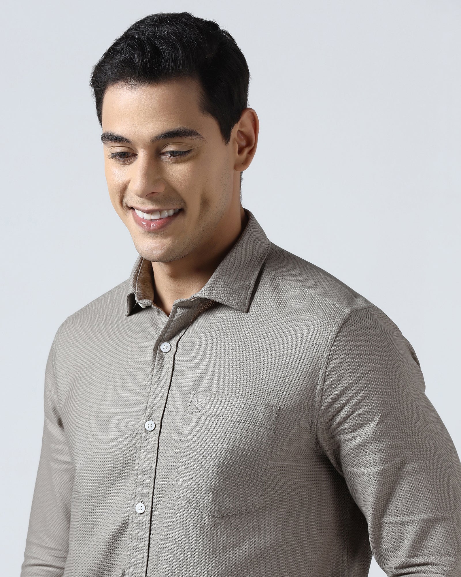 Beige textured men's casual shirt by Blackberry, from Solter brand, hanging on a wooden hanger against a neutral background.