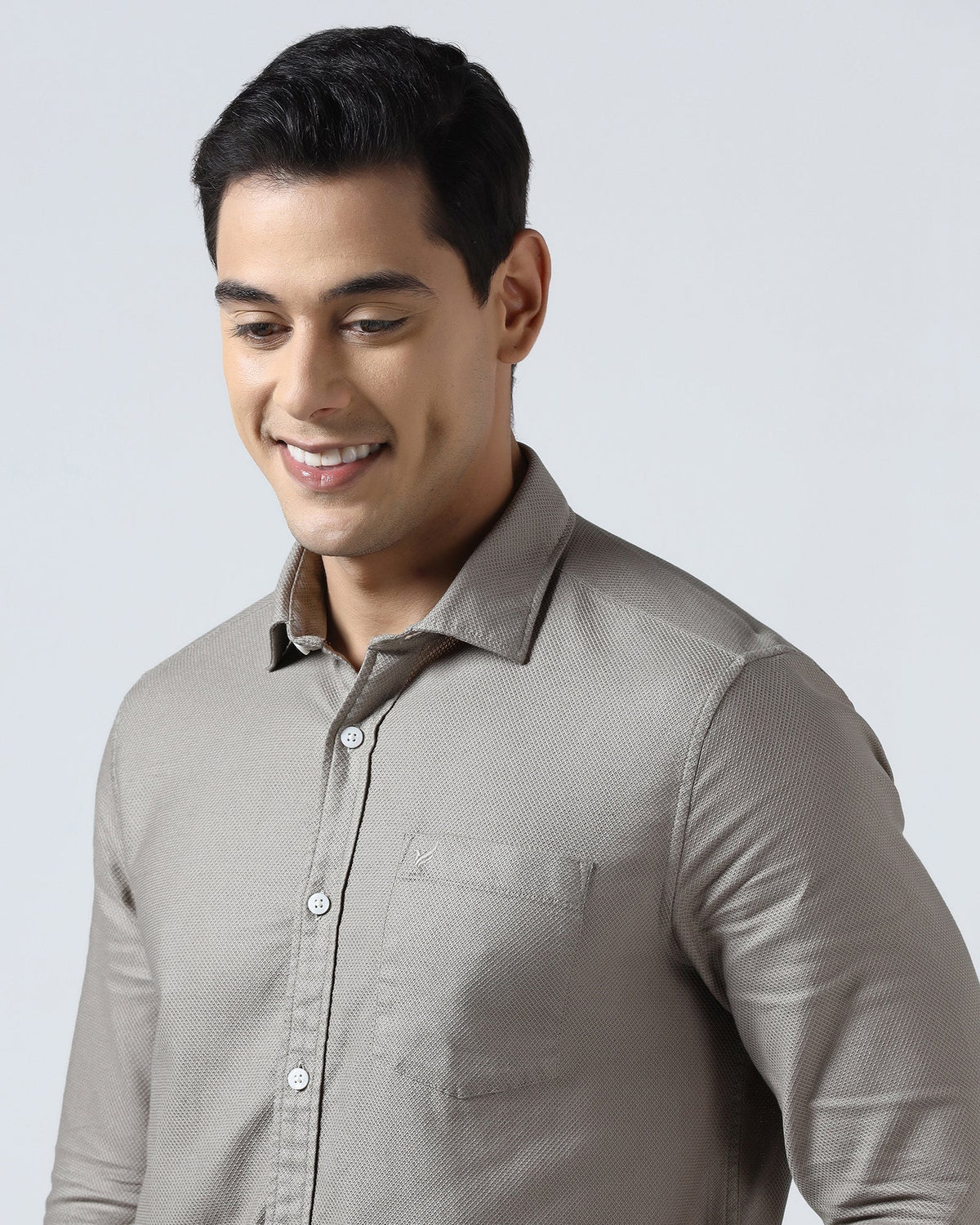 Beige textured men's casual shirt by Blackberry, from Solter brand, hanging on a wooden hanger against a neutral background.