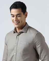Beige textured men's casual shirt by Blackberry, from Solter brand, hanging on a wooden hanger against a neutral background.