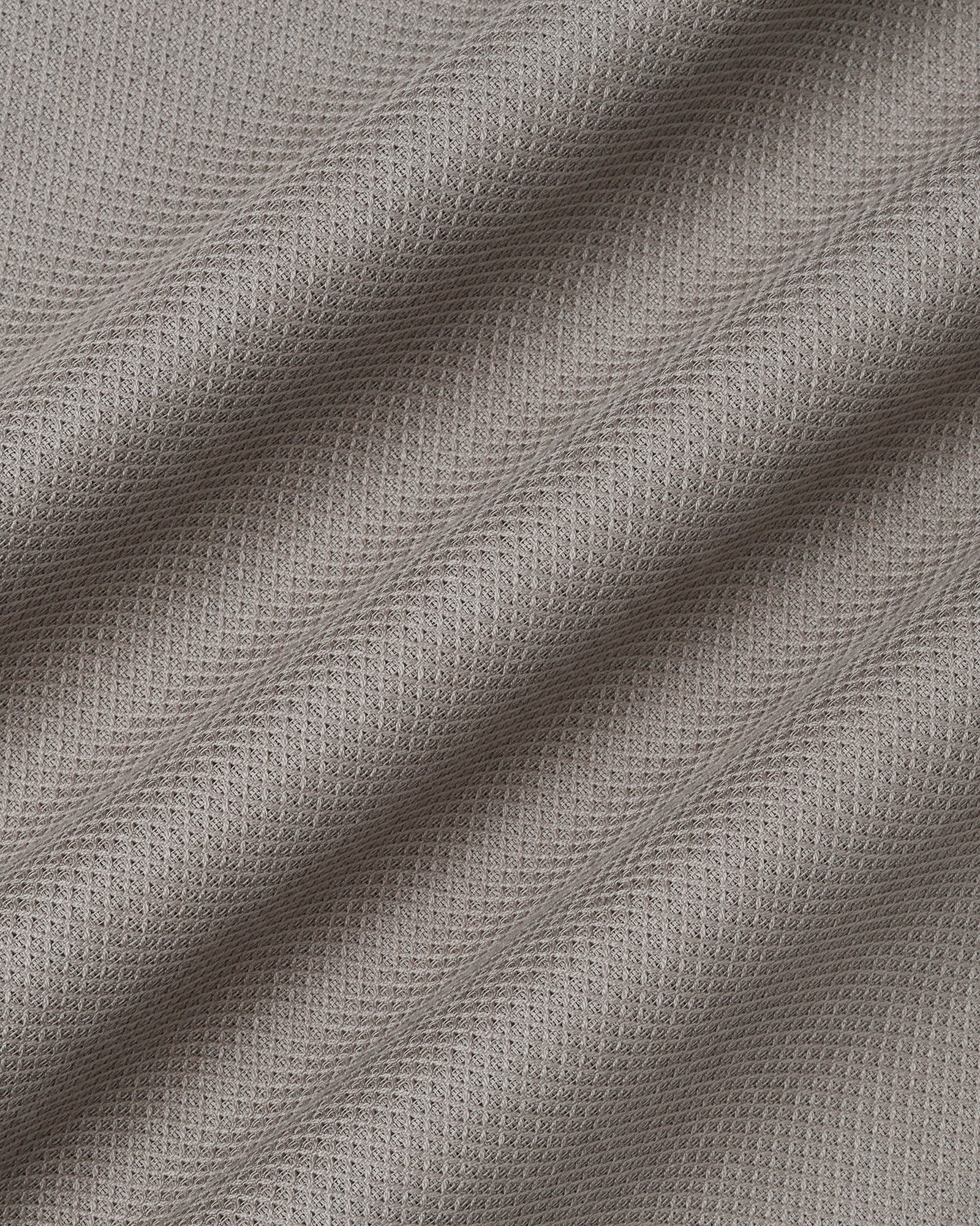 Beige textured men's casual shirt by Blackberry, from Solter, displayed on a hanger showing fabric details and collar design.