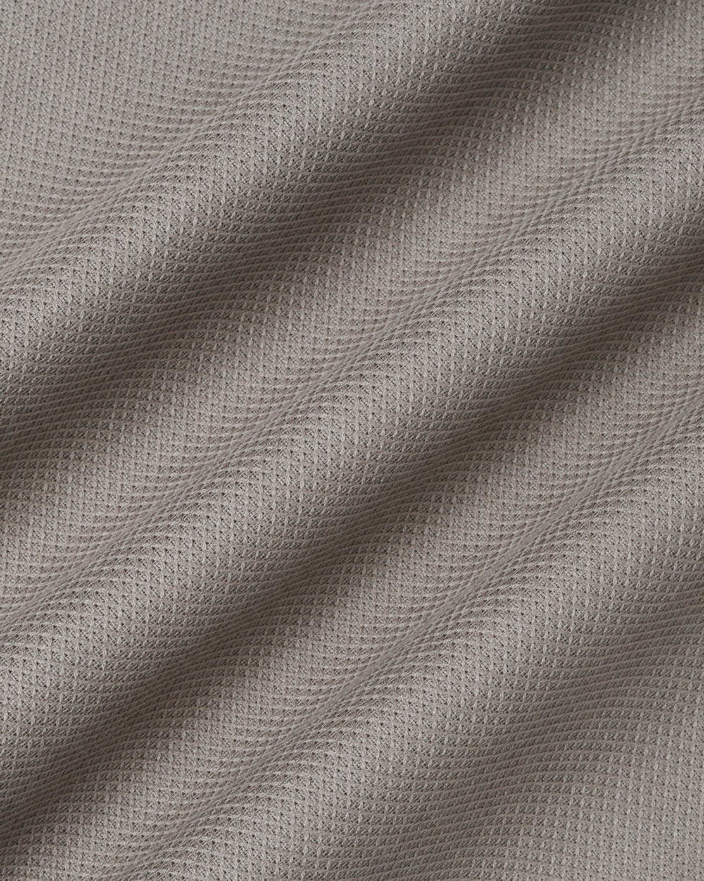 Beige textured men's casual shirt by Blackberry, from Solter, displayed on a hanger showing fabric details and collar design.
