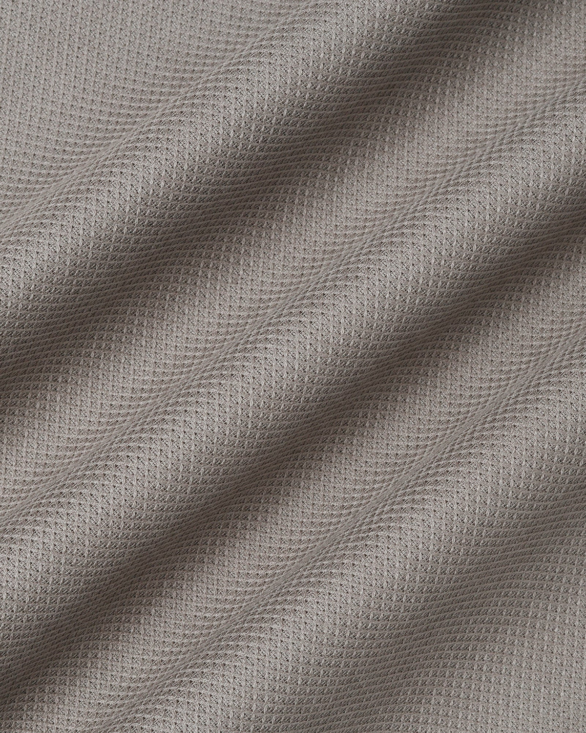 Beige textured men's casual shirt by Blackberry, from Solter, displayed on a hanger showing fabric details and collar design.