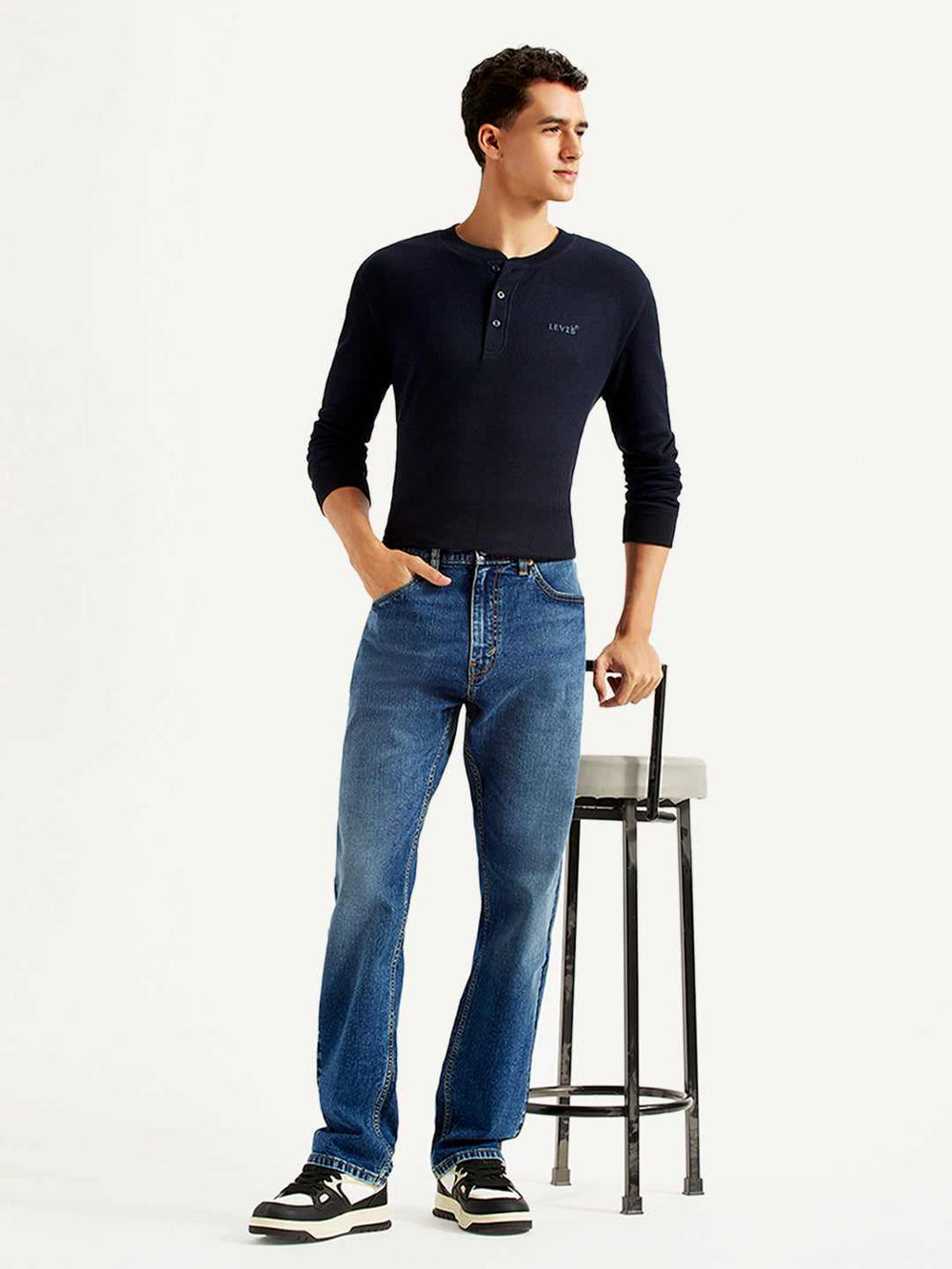 Men's Levi's 505 straight fit blue mid-rise jeans, front view showing classic denim style and relaxed fit.