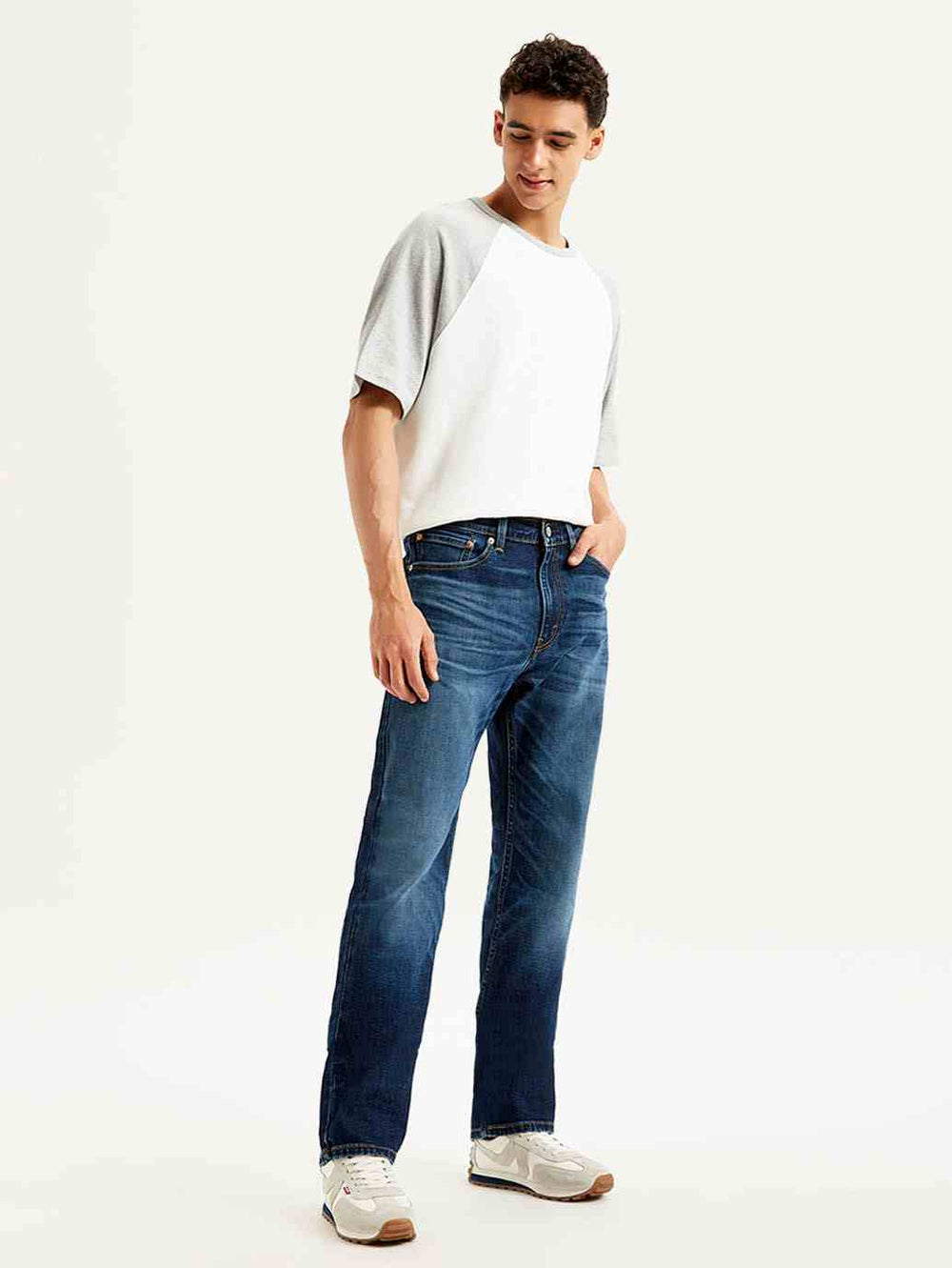 Pair of Levi's men's jeans in classic blue denim showing fit and stitching details, casual style for everyday wear.