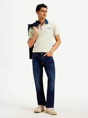 Levi's men's jeans in classic blue denim, slim fit style with five-pocket design, displayed on a hanger.