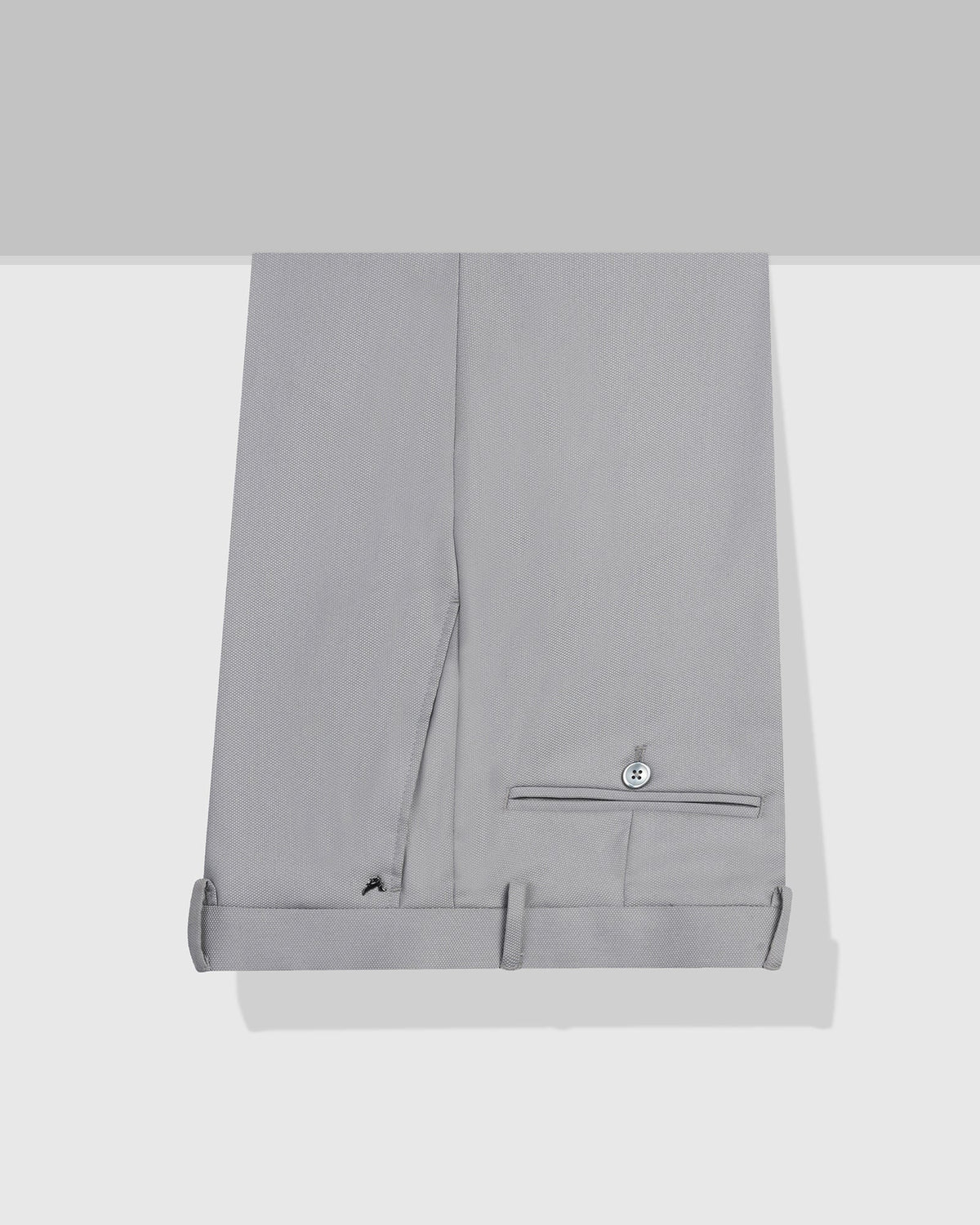 Light grey textured formal men's trouser by Blackberry, designed by Monk, showing the fabric detail and tailored fit.