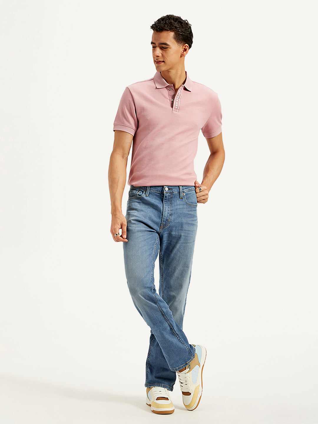 Levi's men's jeans in classic blue denim, straight fit with five-pocket design, displayed on a hanger.
