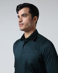 Blackberry men's teal non-iron solid formal shirt named Sylvia, shown laid flat with collar and button details visible.