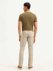 Men's beige slim fit chinos by Levi's, casual men's trousers with a tailored fit, displayed on a plain background.