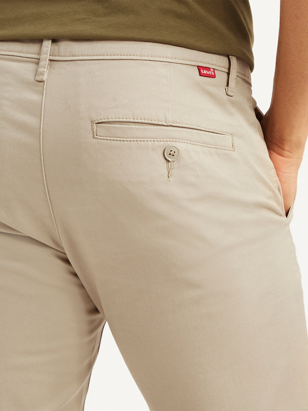 Men's beige slim fit chinos by Levis, casual men's trousers with a tailored fit and classic style, shown on a flat lay.