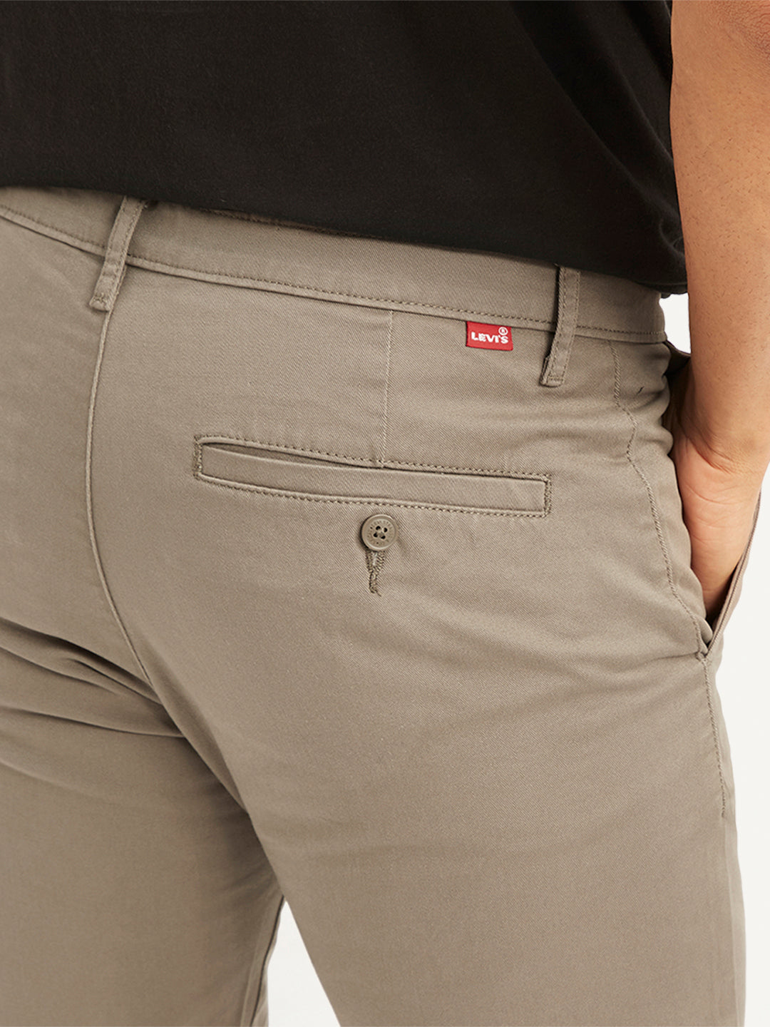 Men's taupe slim fit chinos by Levi's, casual men's lower wear with a tailored fit and classic design, shown in the image.