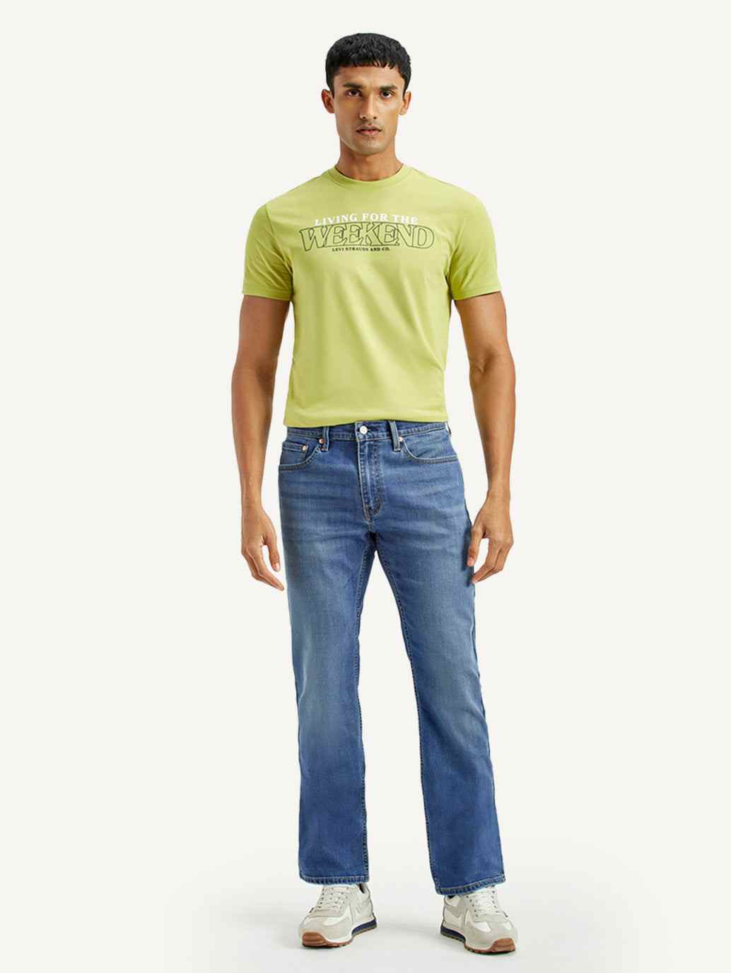 Levis men's jeans in classic blue denim, slim fit style, with visible stitching and five-pocket design.